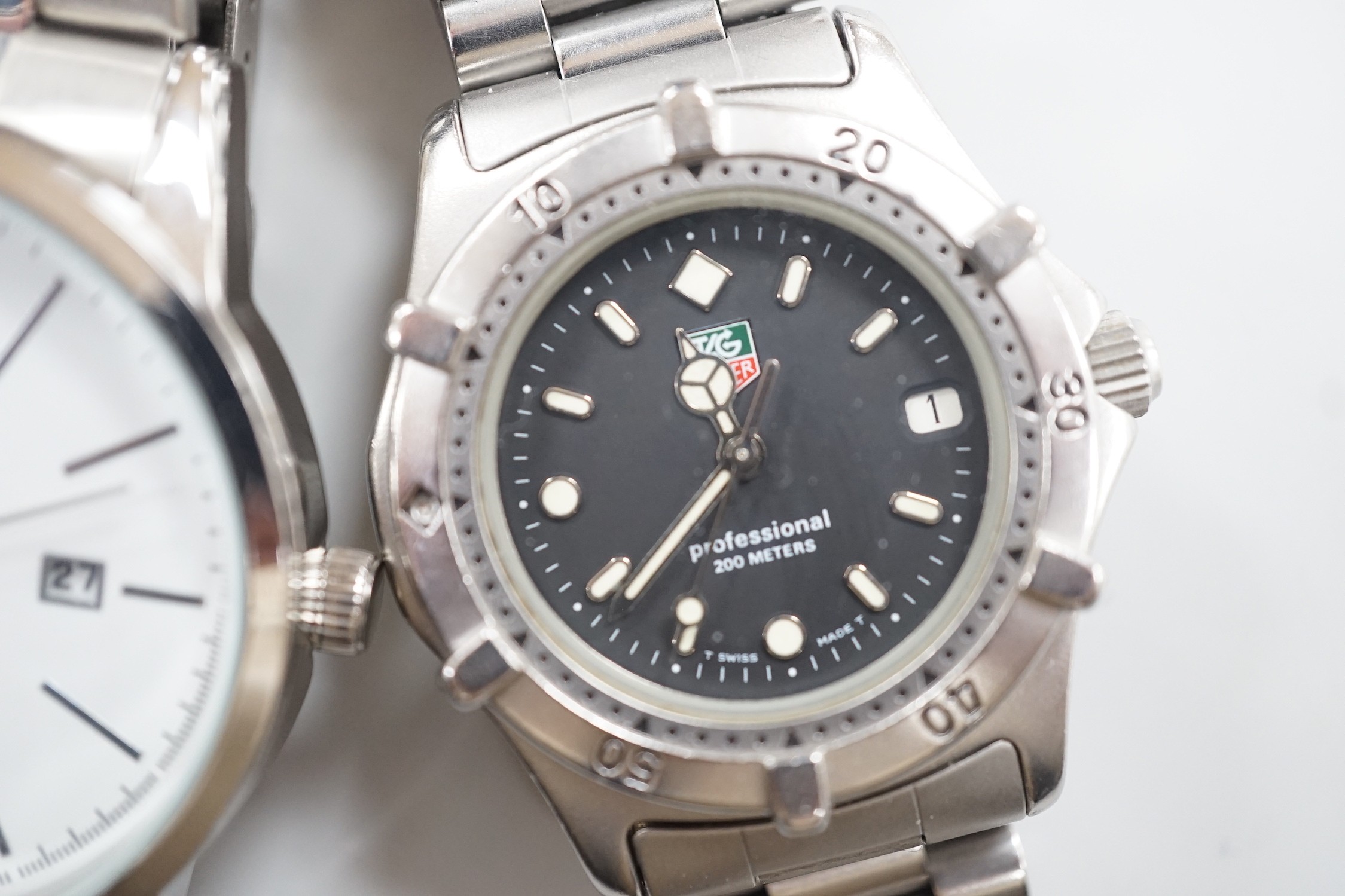A gentleman's stainless steel Tag Heuer quartz wrist watch, together with a gentleman's stainless steel backed Owim GMBH & Co quartz wrist watch.